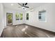 Bright bedroom with hardwood floors, ceiling fan, multiple windows with backyard views, and access to a deck at 281 Griffin Nw St, Atlanta, GA 30314