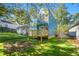 View of backyard shows deck, blue siding, and yard at 281 Griffin Nw St, Atlanta, GA 30314