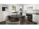 Open kitchen with stainless steel appliances, granite countertops and dining area perfect for entertaining guests at 281 Griffin Nw St, Atlanta, GA 30314