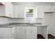 Bright kitchen features white cabinets, granite countertops and stainless steel sink at 281 Griffin Nw St, Atlanta, GA 30314