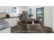 Bright kitchen features white cabinets, stainless steel appliances, and a dining area with modern chairs at 281 Griffin Nw St, Atlanta, GA 30314
