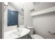 Contemporary powder room featuring a modern vanity, sleek fixtures, and blue door with mirror at 281 Griffin Nw St, Atlanta, GA 30314