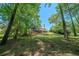 Expansive backyard with lush greenery and a spacious deck, perfect for outdoor entertaining at 4320 Royal Mustang Way, Snellville, GA 30039