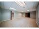 Spacious basement with tile flooring, neutral walls, and recessed lighting at 4320 Royal Mustang Way, Snellville, GA 30039