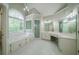 Luxurious bathroom with jetted tub, glass shower, and extended vanity with double sinks at 4320 Royal Mustang Way, Snellville, GA 30039