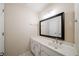 Bathroom with modern vanity, framed mirror, and brushed nickel fixtures at 4320 Royal Mustang Way, Snellville, GA 30039
