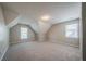 Bright bedroom featuring soft gray walls, plush carpeting, and sunny windows at 4320 Royal Mustang Way, Snellville, GA 30039