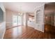Dining room with hardwood floors, built-in shelving, French doors, and trim details with a view of the kitchen at 4320 Royal Mustang Way, Snellville, GA 30039
