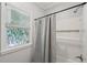 Stylish bathroom features decorative window film, a shower, and a built-in shelf for added convenience at 734 Frasier Se Cir, Marietta, GA 30060