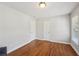 Bright bedroom with hardwood floors and natural light from a large window, providing a serene atmosphere at 734 Frasier Se Cir, Marietta, GA 30060