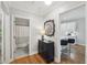 Hallway view of a bathroom with a shower and a kitchen with barstool seating at the counter at 734 Frasier Se Cir, Marietta, GA 30060