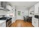 Eat-in kitchen with stainless steel appliances, hardwood floors, and dining area at 734 Frasier Se Cir, Marietta, GA 30060