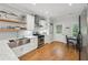 Well-lit kitchen with stainless steel appliances, hardwood floors, and ample counter space at 734 Frasier Se Cir, Marietta, GA 30060
