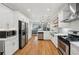 Open concept kitchen featuring stainless steel appliances and hardwood floors at 734 Frasier Se Cir, Marietta, GA 30060