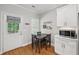 Eat-in kitchen with stainless steel appliances, hardwood floors, and dining area at 734 Frasier Se Cir, Marietta, GA 30060