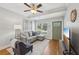 Cozy living area featuring hardwood floors, a ceiling fan, and a front door at 734 Frasier Se Cir, Marietta, GA 30060