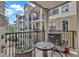 Balcony with an outdoor table and chairs with a view of the surrounding building at 799 Hammond Dr # 314, Atlanta, GA 30328
