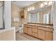 Bathroom with double sinks, granite countertops, and tiled floors at 799 Hammond Dr # 314, Atlanta, GA 30328