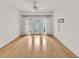 Bright, minimalist bedroom with hardwood floors and French doors leading to a balcony at 799 Hammond Dr # 314, Atlanta, GA 30328