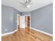 Clean bedroom with hardwood floors, light gray walls, and white trim at 799 Hammond Dr # 314, Atlanta, GA 30328