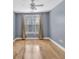 Clean bedroom featuring hardwood floors and a large window with neutral drapes at 799 Hammond Dr # 314, Atlanta, GA 30328