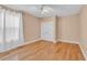 Bedroom with light beige walls, wood flooring, and a ceiling fan at 799 Hammond Dr # 314, Atlanta, GA 30328
