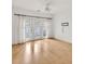 Bright bedroom with hardwood floors and French doors leading to a balcony at 799 Hammond Dr # 314, Atlanta, GA 30328