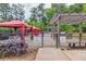 Outdoor grilling and fire pit area with pergolas and cabanas for residents in a wooded area at 799 Hammond Dr # 314, Atlanta, GA 30328