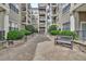 Beautiful courtyard with benches, stone planters and manicured landscaping at 799 Hammond Dr # 314, Atlanta, GA 30328