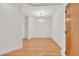 Empty dining room with hardwood flooring, neutral walls, and a modern chandelier at 799 Hammond Dr # 314, Atlanta, GA 30328