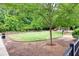 A fenced grassy area within a community dog park, featuring play structures and seating at 799 Hammond Dr # 314, Atlanta, GA 30328