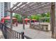 Outdoor grilling area with pergola and gas grill with stone surround at 799 Hammond Dr # 314, Atlanta, GA 30328