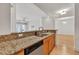 Kitchen with granite countertops, stainless steel appliances, and an open view of the spacious living area at 799 Hammond Dr # 314, Atlanta, GA 30328
