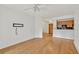 An open concept living room showing light hardwood floors and a view of the kitchen with stainless steel appliances at 799 Hammond Dr # 314, Atlanta, GA 30328