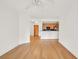 Bright open concept living and dining area with hardwood floors and open view of the kitchen and stainless steel appliances at 799 Hammond Dr # 314, Atlanta, GA 30328