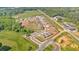 An aerial view captures the community's layout surrounded by lush greenery at 127 Laurel Farms Ln, Dallas, GA 30157