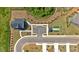 An aerial view displays the community layout with a putting green, green lawns, and manicured landscaping at 127 Laurel Farms Ln, Dallas, GA 30157
