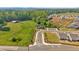 An aerial view of a residential community surrounded by lush green fields at 127 Laurel Farms Ln, Dallas, GA 30157