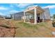 A charming backyard with a covered patio and seating area, perfect for outdoor relaxation and entertaining at 127 Laurel Farms Ln, Dallas, GA 30157