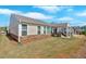 A well-maintained backyard with a covered patio area provides great outdoor living space at 127 Laurel Farms Ln, Dallas, GA 30157