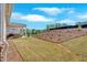 This spacious backyard features a covered patio, professionally installed landscaping, and sod at 127 Laurel Farms Ln, Dallas, GA 30157