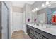 Modern bathroom featuring double sinks, vanity, and tile shower with glass door at 127 Laurel Farms Ln, Dallas, GA 30157