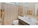 This cozy bathroom features a shower curtain, framed painting, modern faucet, and neutral paint at 127 Laurel Farms Ln, Dallas, GA 30157
