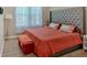Comfortable bedroom with tufted headboard and floral bedding, with lots of natural light at 127 Laurel Farms Ln, Dallas, GA 30157