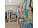 Spacious walk-in closet with custom shelving and organization system for ample storage at 127 Laurel Farms Ln, Dallas, GA 30157
