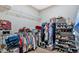 Spacious walk-in closet with custom shelving and organization system for ample storage at 127 Laurel Farms Ln, Dallas, GA 30157