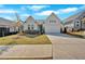 Inviting home with a well-manicured lawn, stone accents, and a two-car garage in a friendly neighborhood at 127 Laurel Farms Ln, Dallas, GA 30157