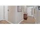 Bright hallway with wood-look flooring, neutral walls, and a view towards the front door at 127 Laurel Farms Ln, Dallas, GA 30157