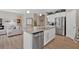 Bright, open kitchen with stainless steel appliances, granite countertops, and hardwood flooring at 127 Laurel Farms Ln, Dallas, GA 30157