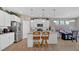 Well-equipped kitchen with stainless steel appliances, granite countertops, and an eat-in island at 127 Laurel Farms Ln, Dallas, GA 30157
